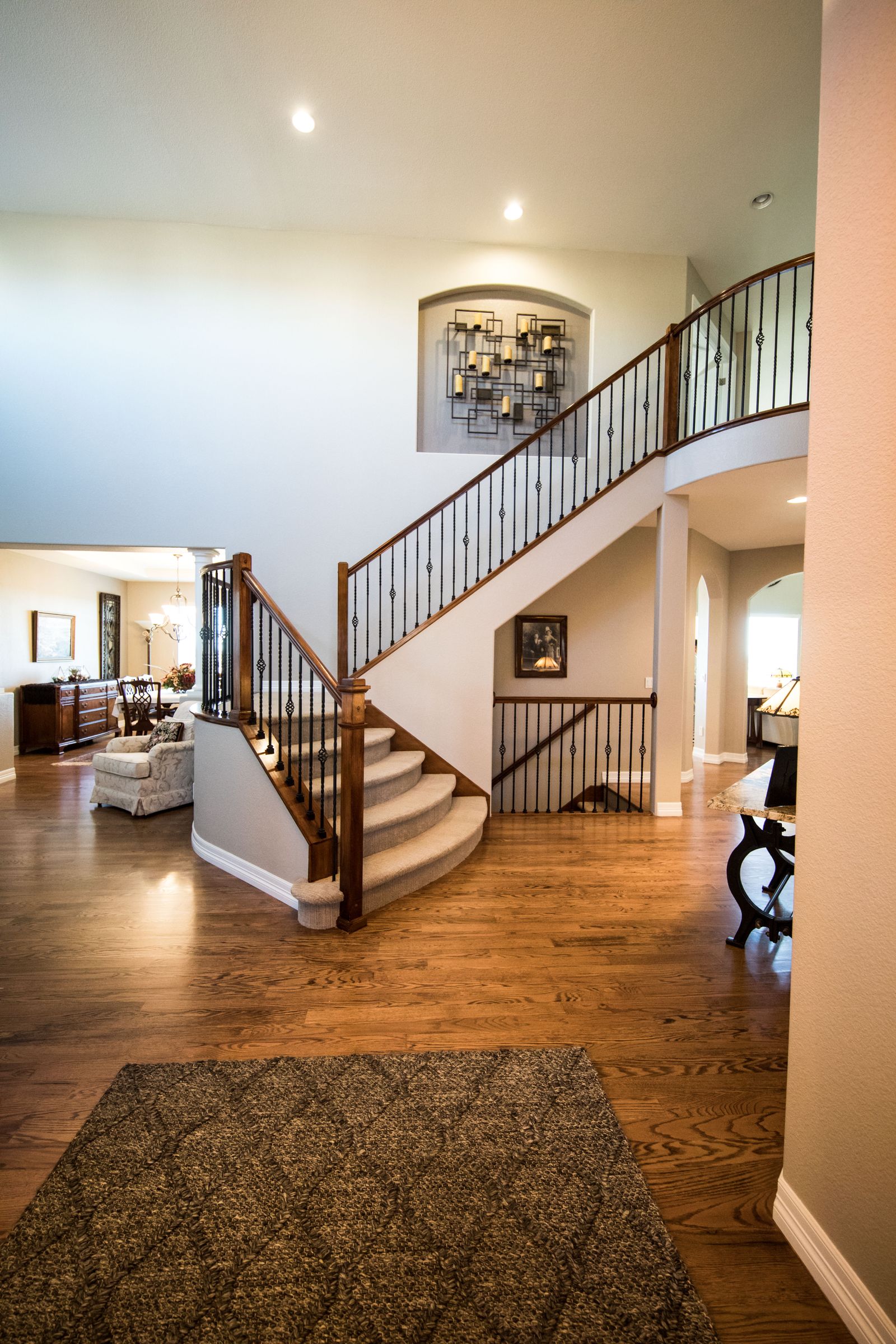 A renovated hallway and staircase — the standard of finish the firm works to